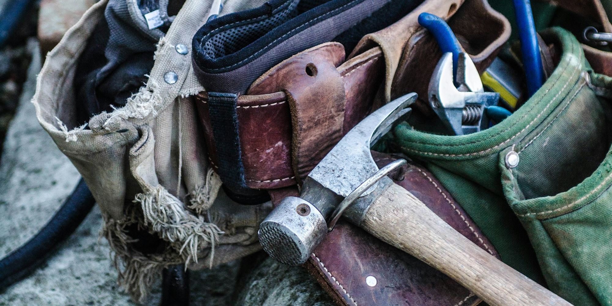Brown handled hammer and tool belt